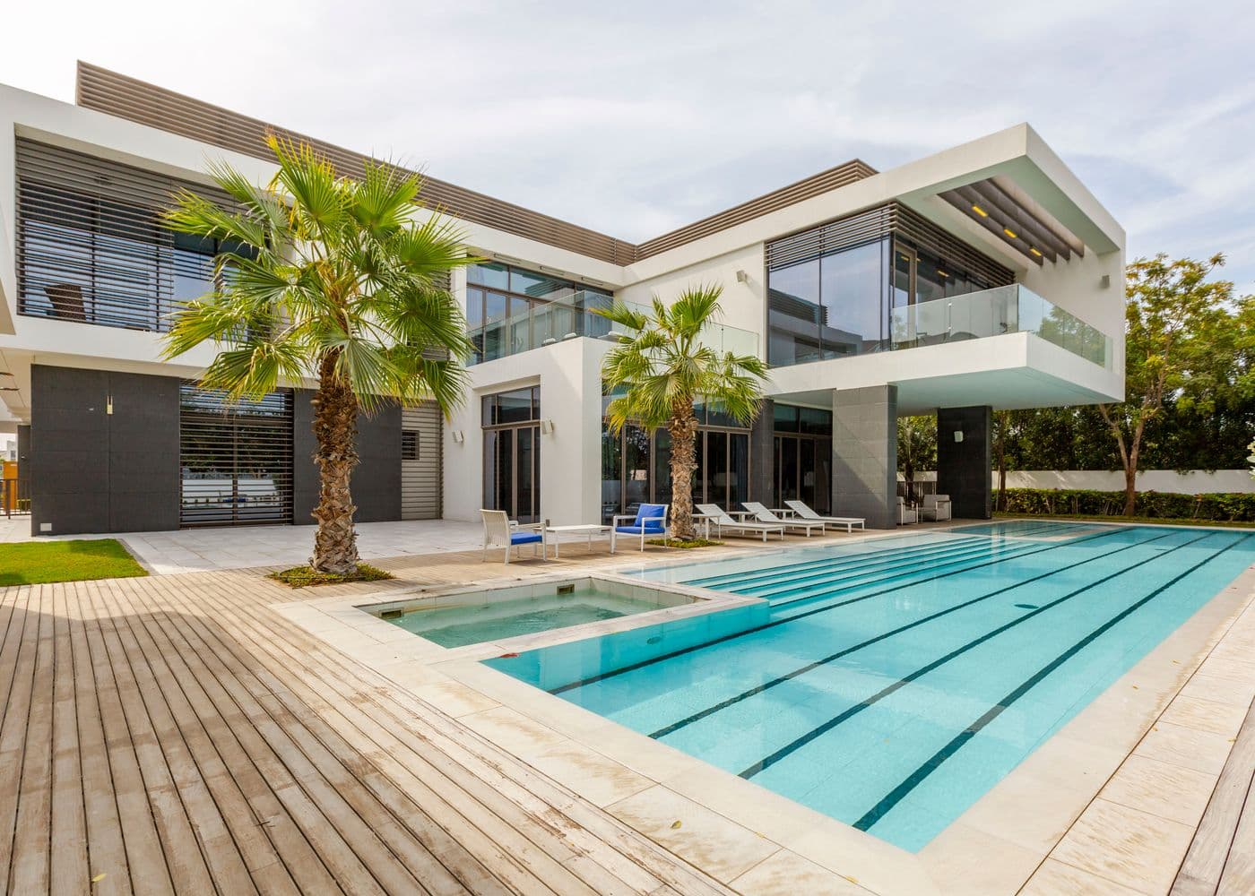 A modern luxury villa with a swimming pool, typical of Dubai villa communities
